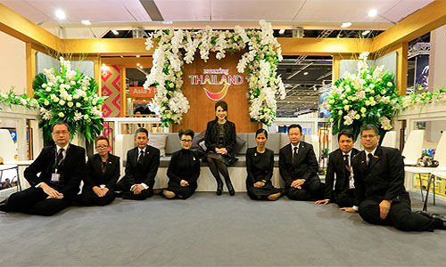 Front row: H.E. Mrs. Kobkarn Wattanavrangkul (middle), Minister of Tourism and Sports; Mr. Kalin Sarasin (left), Chairman of the Board of TAT; and Mr. Yuthasak Supasorn (right), TAT Governor; as well as members of the Board of TAT at the Thailand pavilion