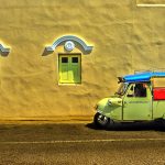 The unique frog-head tuk-tuk and Sino-Portuguese building in Trang city