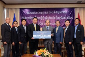 TAT contributes proceeds of charity golf tournament to help flood victims in Lao PDR