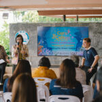 Speaker presents Coral College initiative at Chalong Pier, Phuket press conference, 24 July 2025.