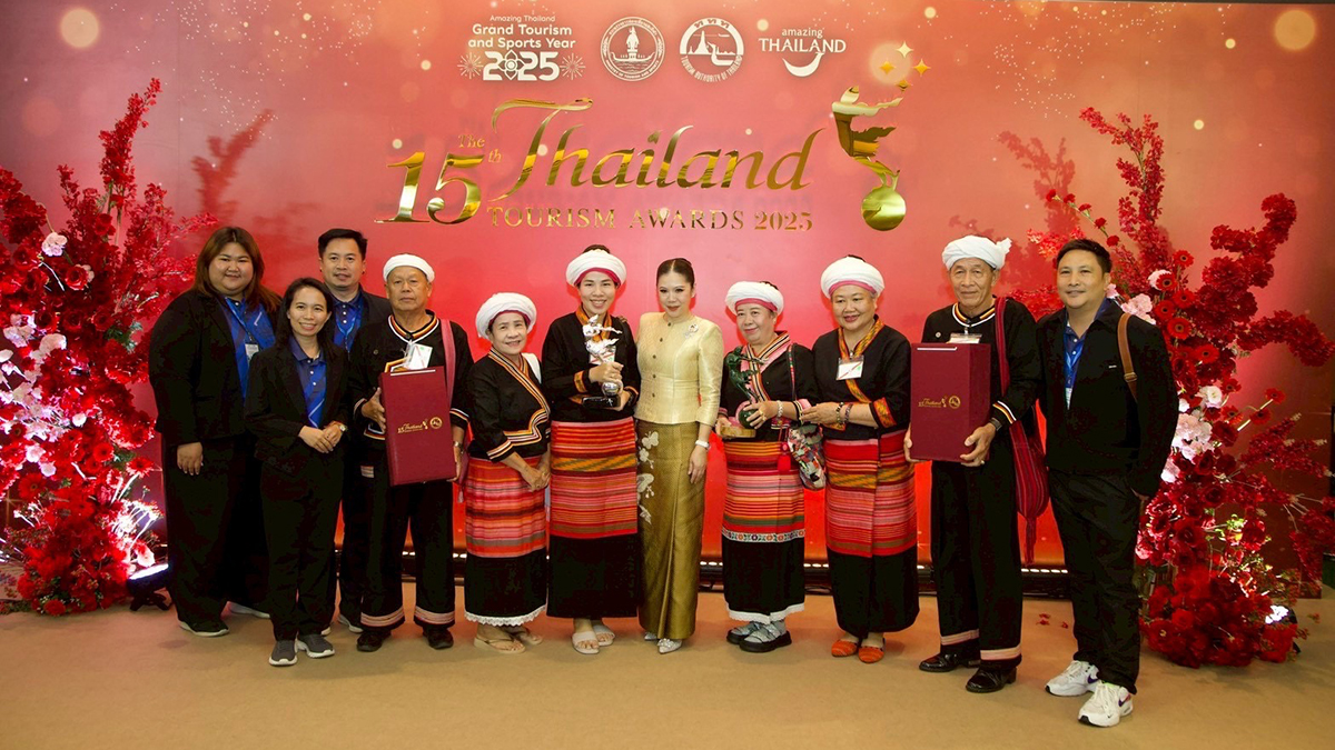 Ms. Thapanee Kiatphaibool, Governor of the Tourism Authority of Thailand, stands with award recipients in traditional attire at the 15th Thailand Tourism Awards 2025 ceremony in Bangkok.