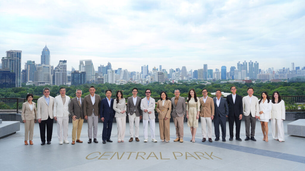 Central Park Bangkok opening group photo with executives against city skyline.