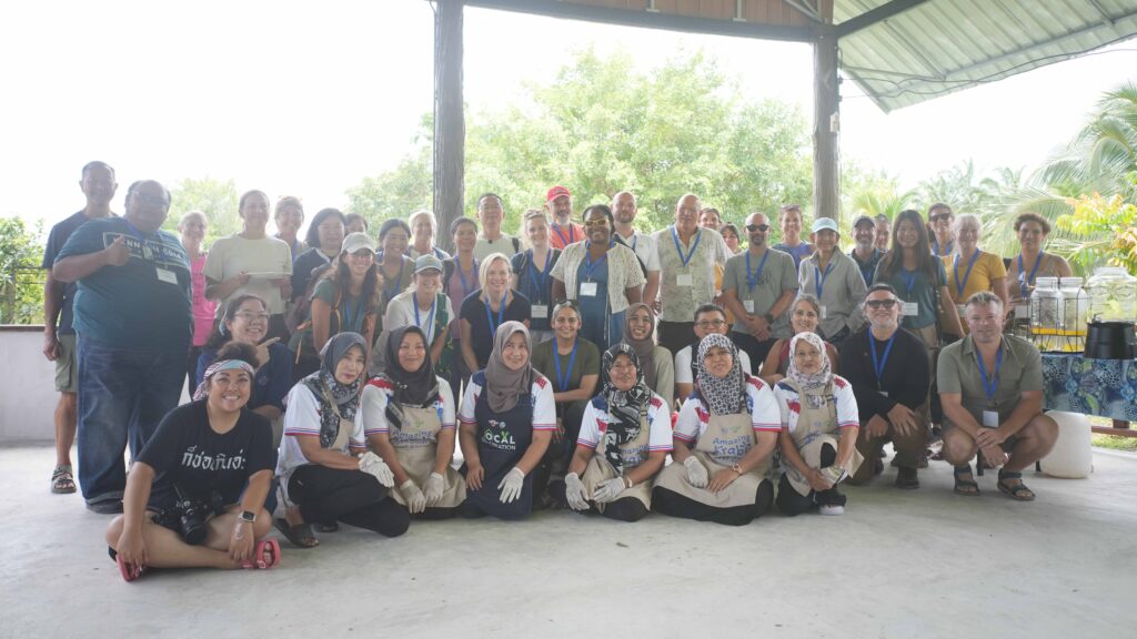 Delegates join Ban Laem Sak community members in Krabi, highlighting local participation in sustainable tourism at the Global Meaningful Travel Summit.