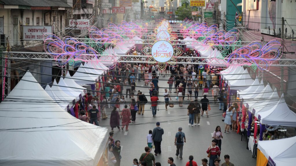 Crowds stroll through the illuminated Diwali Market at Phahurat, lined with stalls and colorful lights during the Amazing Thailand Grand Diwali Festival 2025.