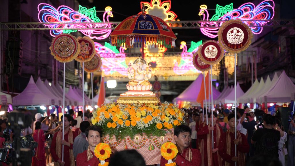 Procession featuring a statue of Lord Ganesha adorned with flowers and marigolds under glowing lights at the Amazing Thailand Grand Diwali Festival 2025.