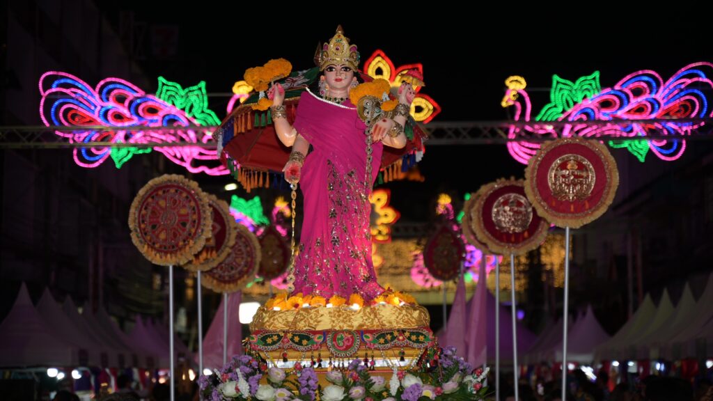Statue of Goddess Lakshmi adorned with marigolds and lights during the Grand Procession of Exquisite Radiance at the Amazing Thailand Grand Diwali Festival 2025.