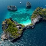 Aerial view of Ko Ha in Mu Ko Lanta National Park, Krabi, showcasing turquoise waters, coral reefs, and limestone islands within a protected marine area.