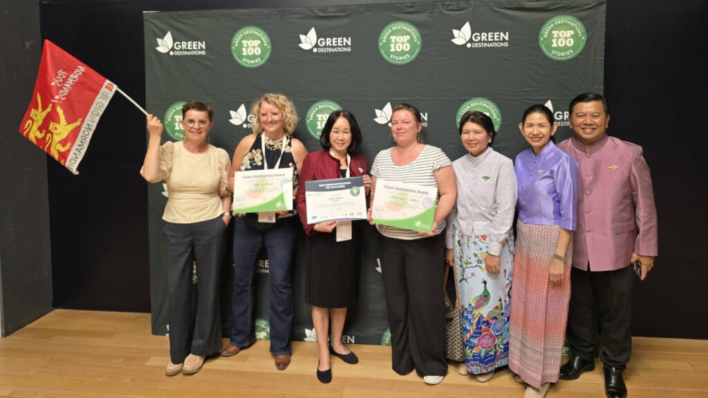 Delegates from Thailand and international representatives celebrate at the Green Destinations Top 100 Stories 2025 ceremony in Montpellier, France.