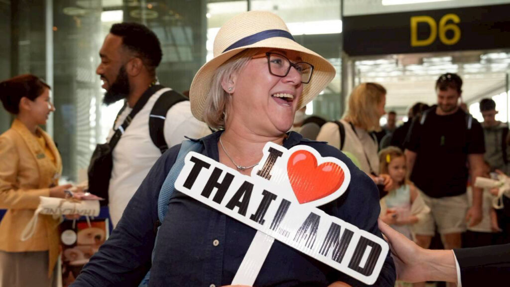 Passenger holds an “I Love Thailand” sign upon arrival at Suvarnabhumi Airport on Norse Atlantic Airways’ first flight.