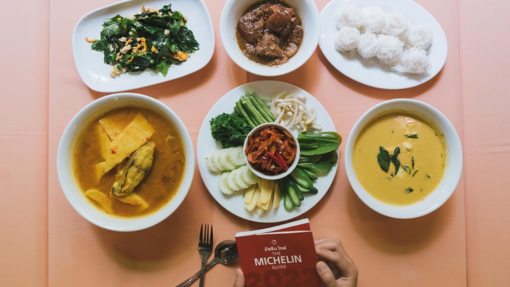 Authentic Southern Thai dishes at Raya Restaurant in Phuket, featuring curry, vegetables, and Michelin-recommended cuisine.