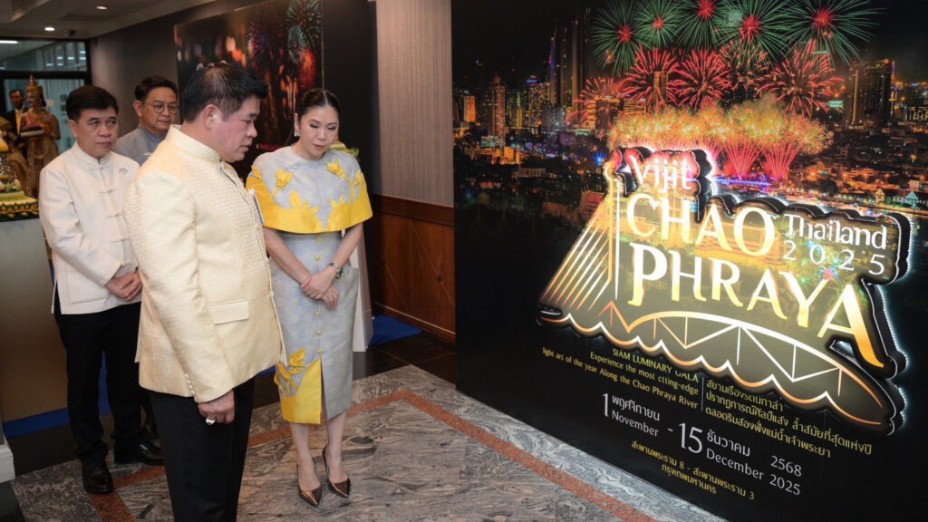 Officials observe the Vijit Chao Phraya 2025 display featuring the event logo and fireworks backdrop during the tourism event preview at Government House.