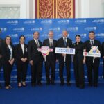 Officials from the Tourism Authority of Thailand and United Airlines pose together during the inaugural Los Angeles–Bangkok flight welcome event at Suvarnabhumi Airport.