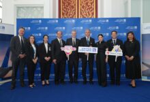 Officials from the Tourism Authority of Thailand and United Airlines pose together during the inaugural Los Angeles–Bangkok flight welcome event at Suvarnabhumi Airport.