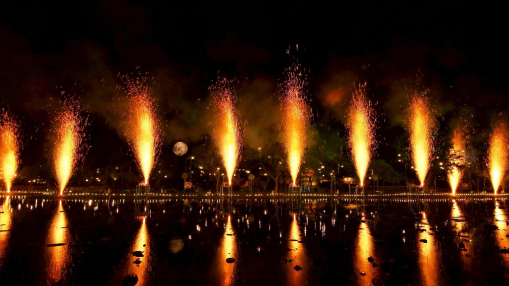 Fire fountains illuminate the pond at Wat Phra Ram, creating a stunning reflection during Maha Loi Krathong @Ayutthaya 2025.