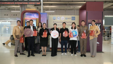 Group photo of TAT executives, immigration officers, and airport partners promoting the Amazing Thailand Passport Privileges 2025 campaign at Suvarnabhumi Airport.