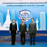 Senior representatives stand on stage at the Trusted Thailand launch event, with the certification logo and city skyline backdrop highlighting Thailand’s tourism safety initiative.