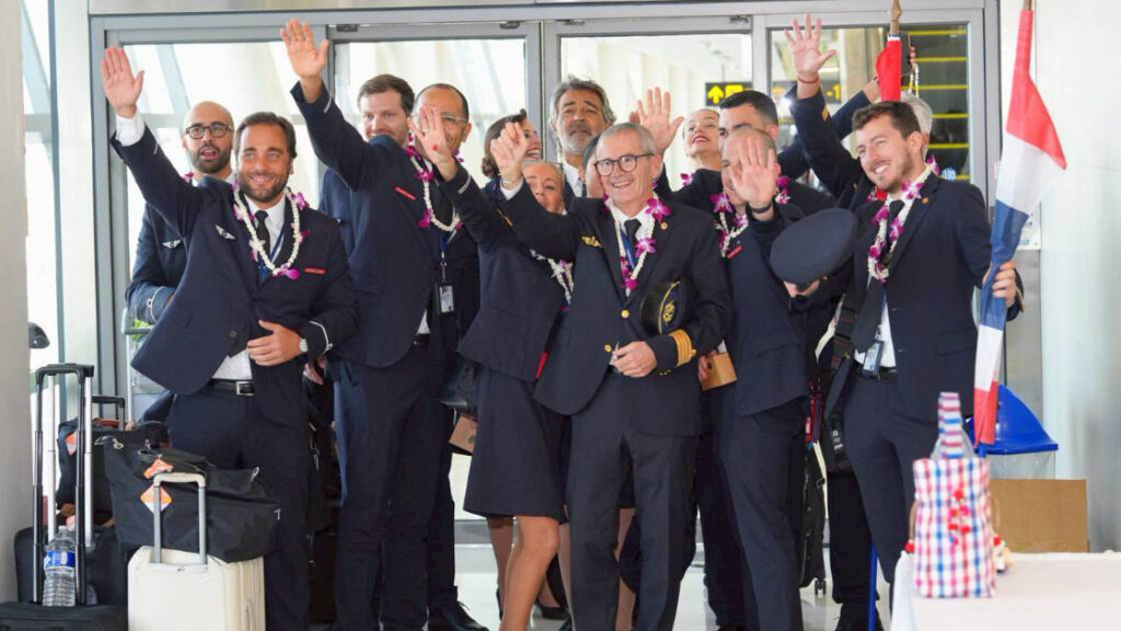 Air France pilots and cabin crew waving and posing with garlands upon arrival in Phuket for the inaugural Paris–Phuket direct flight.