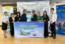 TAT and Don Mueang Airport representatives pose with a commemorative banner to mark the inaugural Citilink Jakarta–Bangkok flight at Don Mueang International Airport.