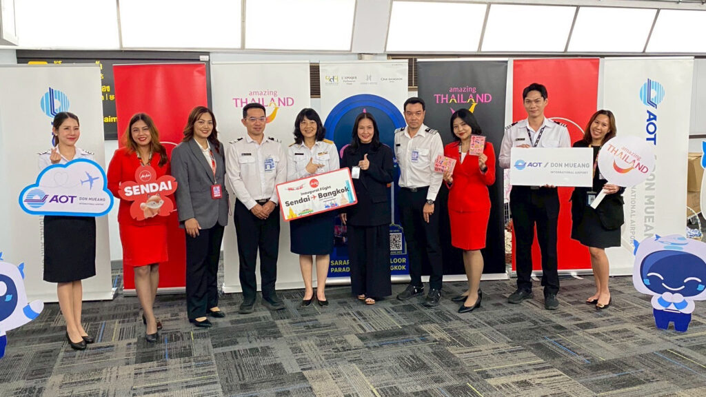 TAT, AOT and Thai AirAsia X representatives pose with signage celebrating the inaugural Sendai–Bangkok flight at Don Mueang Airport.