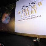Large cinema screen displaying Thailand’s “Healing Is the New Luxury” campaign as TAT presents at CineAsia 2025 in Bangkok.