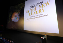Large cinema screen displaying Thailand’s “Healing Is the New Luxury” campaign as TAT presents at CineAsia 2025 in Bangkok.