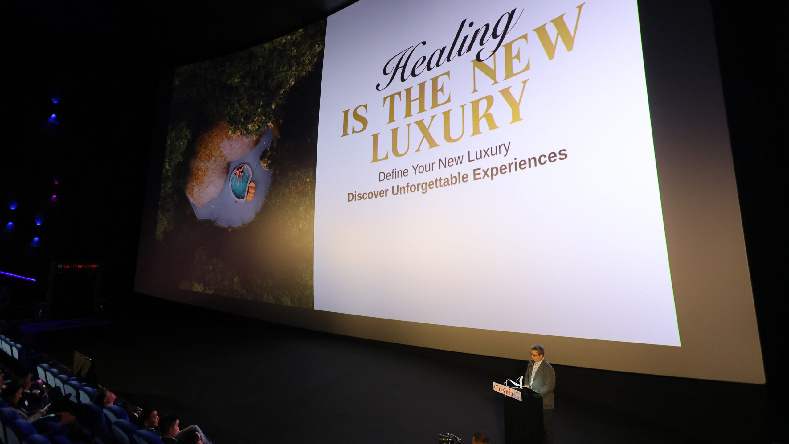 Large cinema screen displaying Thailand’s “Healing Is the New Luxury” campaign as TAT presents at CineAsia 2025 in Bangkok.