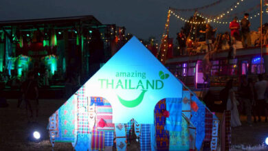 Amazing Thailand pavilion illuminated at Wonderfruit 2025, showcasing TAT’s presence within the festival’s night-time cultural and music setting in Chon Buri.