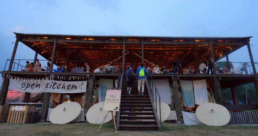 Open Kitchen at Wonderfruit 2025, supported by TAT, highlighting Thai culinary wisdom from five regions in a communal, open-air dining space.