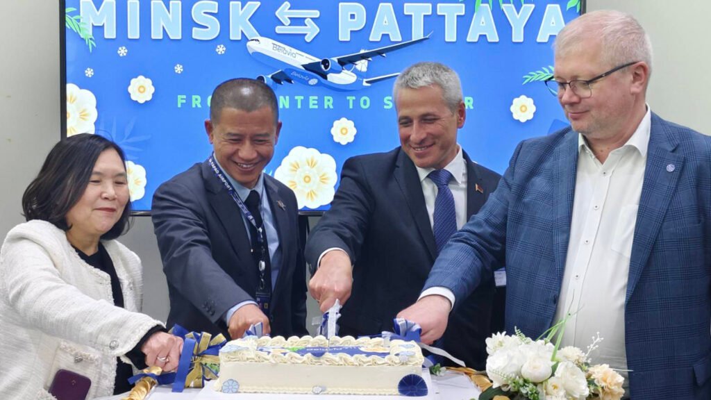 Close-up of ceremonial cake cutting celebrating Belavia Belarusian Airlines’ inaugural Minsk–Pattaya flight to Thailand
