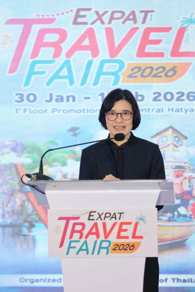 Ms. Wajanan Silpawornwiwat, TAT Executive Director of the Southern Region Department, delivers opening remarks at the Expat Travel Fair 2026 podium in Hat Yai.