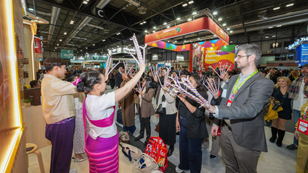 Visitors engage in a Thai cultural activity at the Amazing Thailand pavilion at FITUR 2026, Madrid.