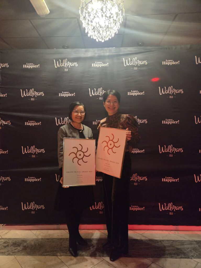 Tourism Authority of Thailand representatives hold Best Tourist Country and Best Tourist Office awards at the Grand Travel Award 2026.