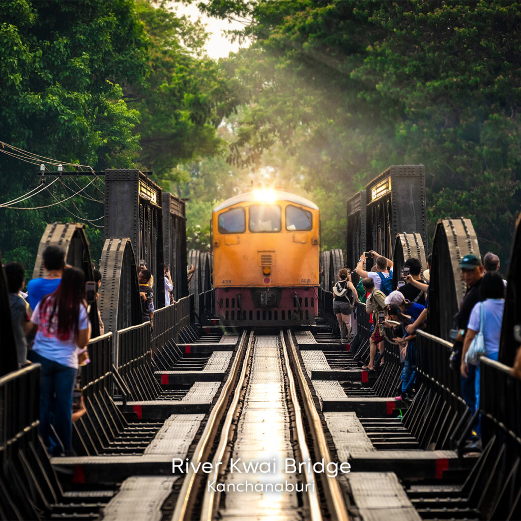 River Kwai Bridge in Kanchanaburi with historic train crossing, symbolising reflection, memory and emotional renewal through travel.