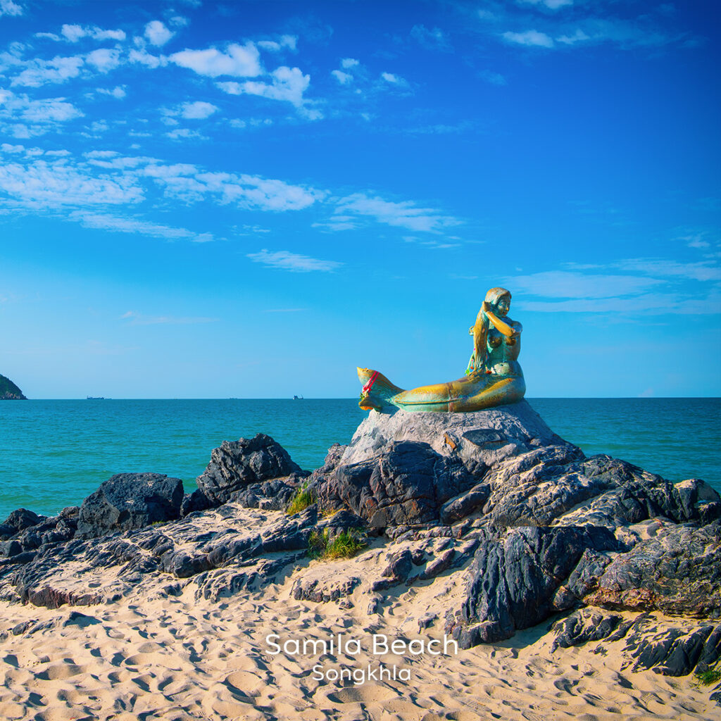 Samila Beach in Songkhla featuring the iconic mermaid statue, highlighting coastal serenity, local identity and southern Thai hospitality.