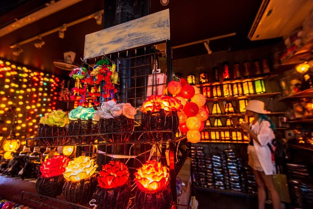 Chatuchak Weekend Market in Bangkok showcasing colourful handcrafted lanterns and decorative lights inside a vibrant market stall.