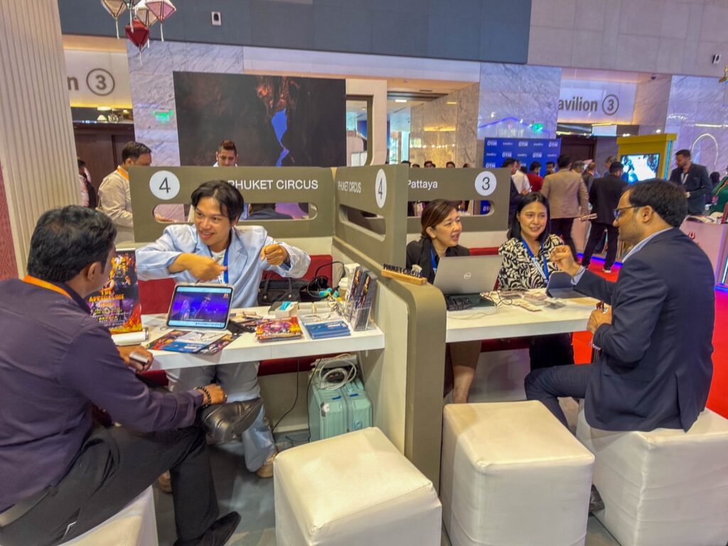 Business-to-business meeting at the Thailand pavilion, with Thai tourism representatives presenting destination and product information to Indian trade partners during Outbound Travel Mart 2026.