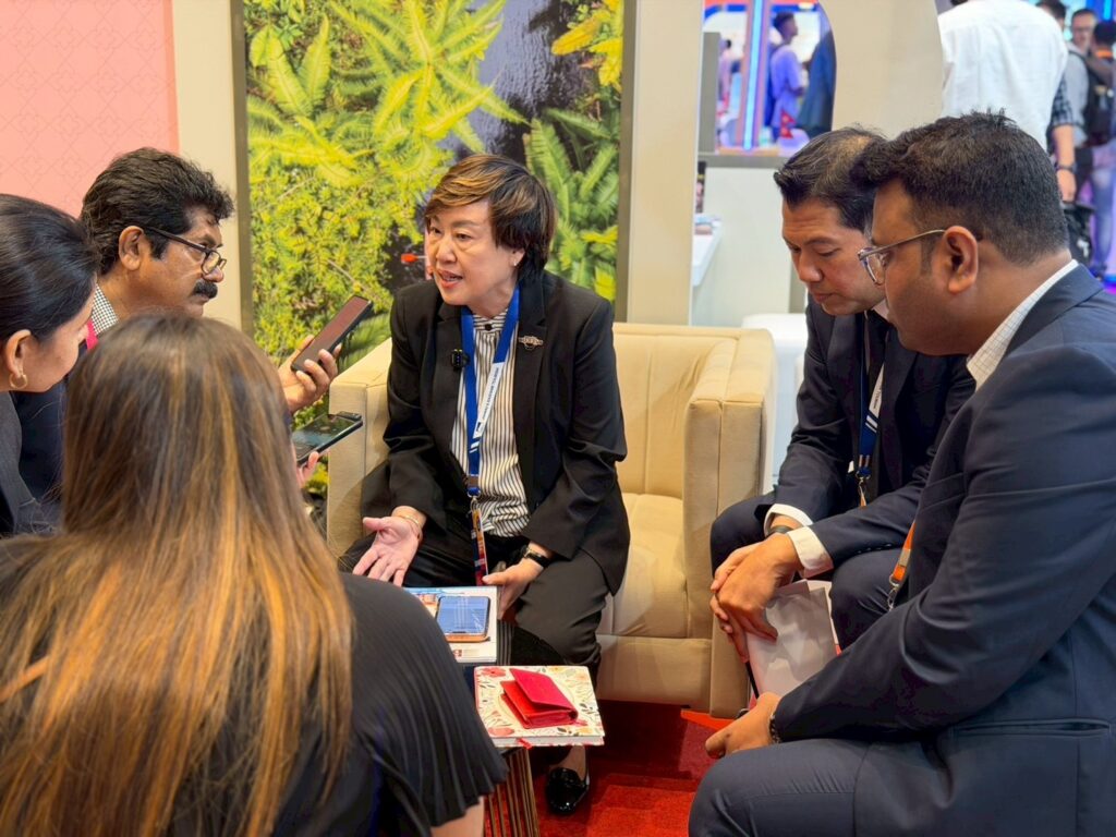 Business-to-business meeting at the Thailand pavilion, with Thai tourism representatives presenting destination and product information to Indian trade partners during Outbound Travel Mart 2026.