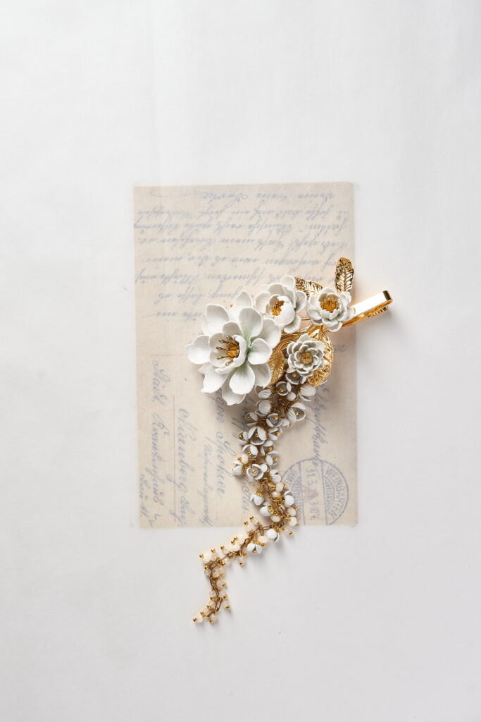 SARRAN The Ambassador Collection cascading jasmine and crown flower brooch inspired by Siamese diplomatic heritage.
