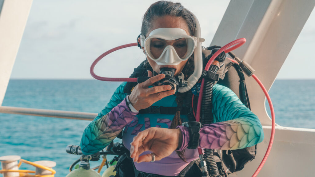 Diver checks equipment before a wellness-led scuba diving experience supported by TAT and PADI in Thailand