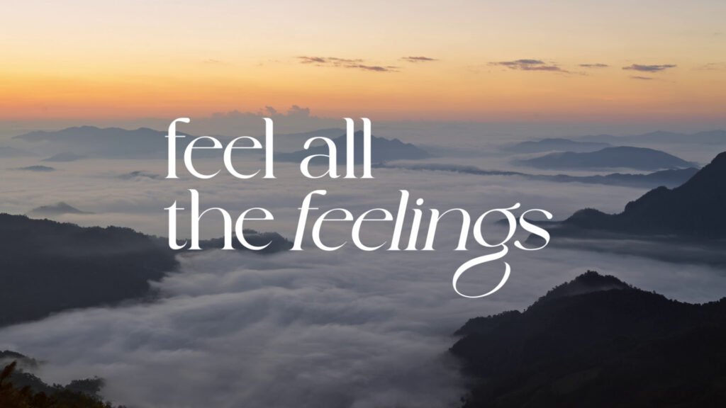 Campaign visual reading “feel all the feelings” over a sea of mist at dawn, representing the emotional travel journey presented by TAT and LISA.