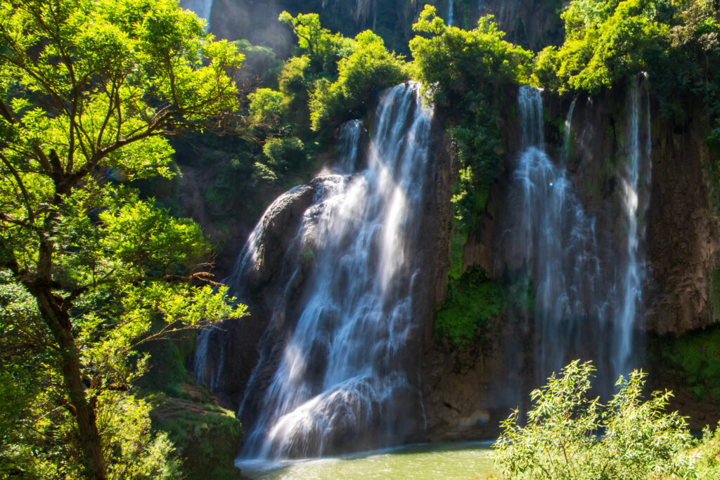 Tiered cascades of Thi Lo Su Waterfall flowing through lush forest in Tak, capturing the power and freshness of northern Thailand’s natural wonders.