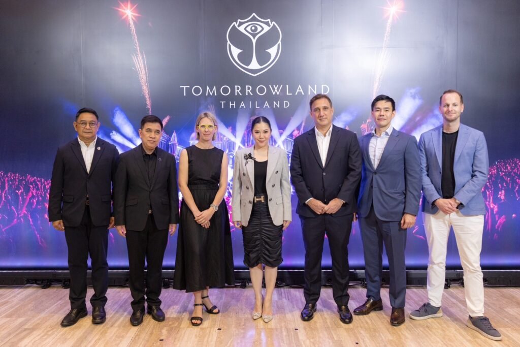 TAT executives and Tomorrowland representatives announce Tomorrowland Thailand 2026 at official launch event in Bangkok.