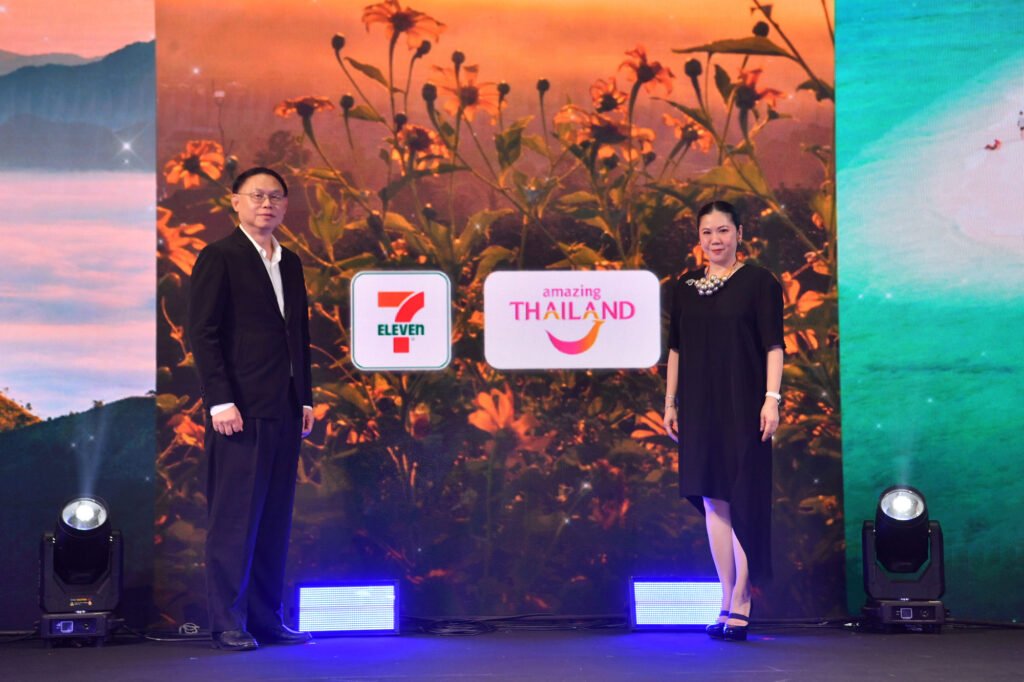 TAT Governor and CP All executive at campaign launch backdrop featuring Amazing Thailand and 7-Eleven branding