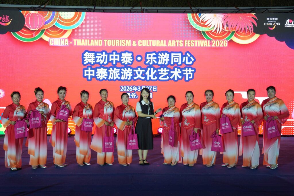 Group of performers in traditional costumes on stage