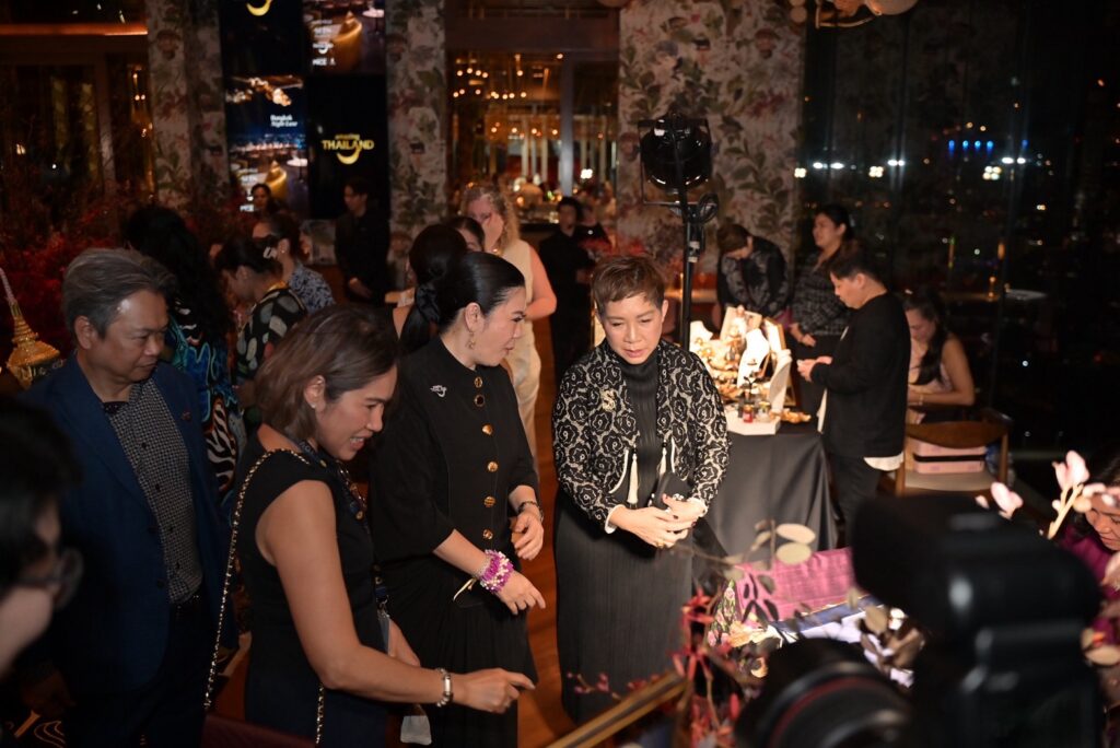 7. TAT executives and guests exploring Thai craftsmanship showcase at Amazing Thailand Bangkok Night Luxe event