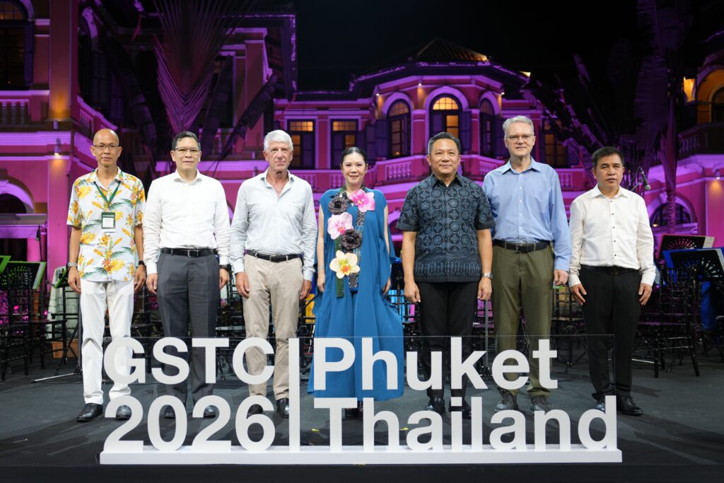 GSTC 2026 Phuket Thailand evening event with global delegates posing behind conference signage at heritage venue