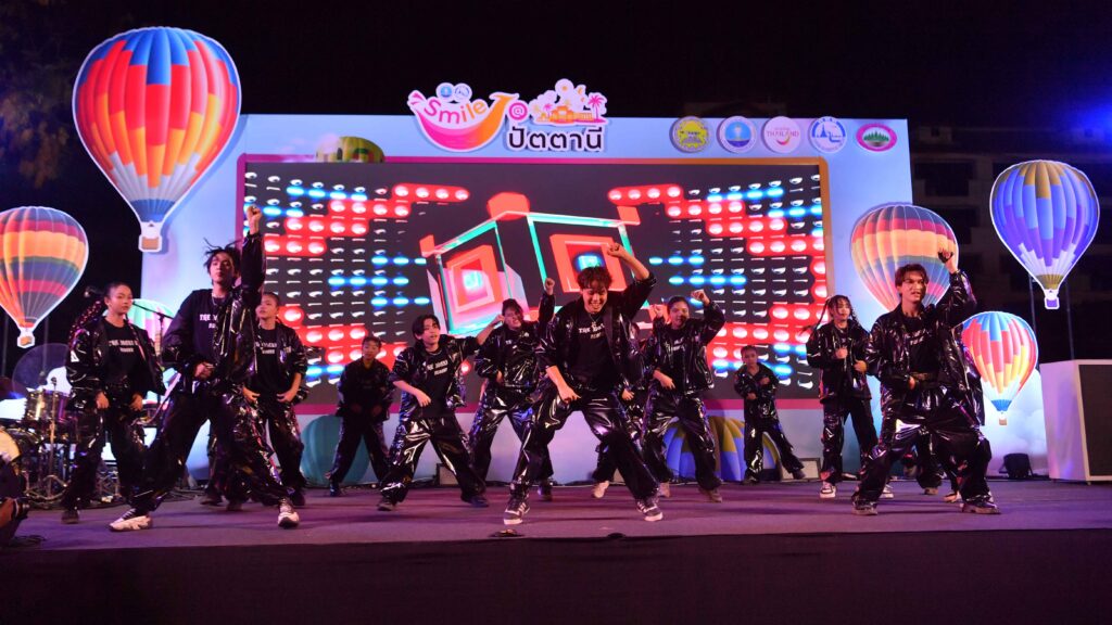 Youth dance performance on stage at Smile @Pattani festival showcasing modern cultural entertainment