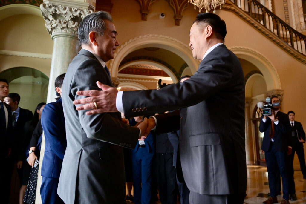 H.E. Mr. Wang Yi and H.E. Mr. Anutin Charnvirakul exchange greetings ahead of Thailand–China diplomatic consultations at Government House, Bangkok, April 2026.