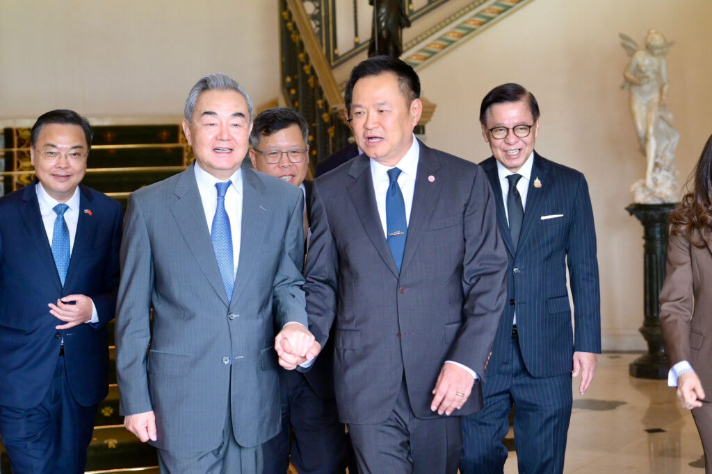 H.E. Mr. Wang Yi and H.E. Mr. Anutin Charnvirakul walk together with senior officials following the conclusion of bilateral meetings at Government House, Bangkok, April 2026.