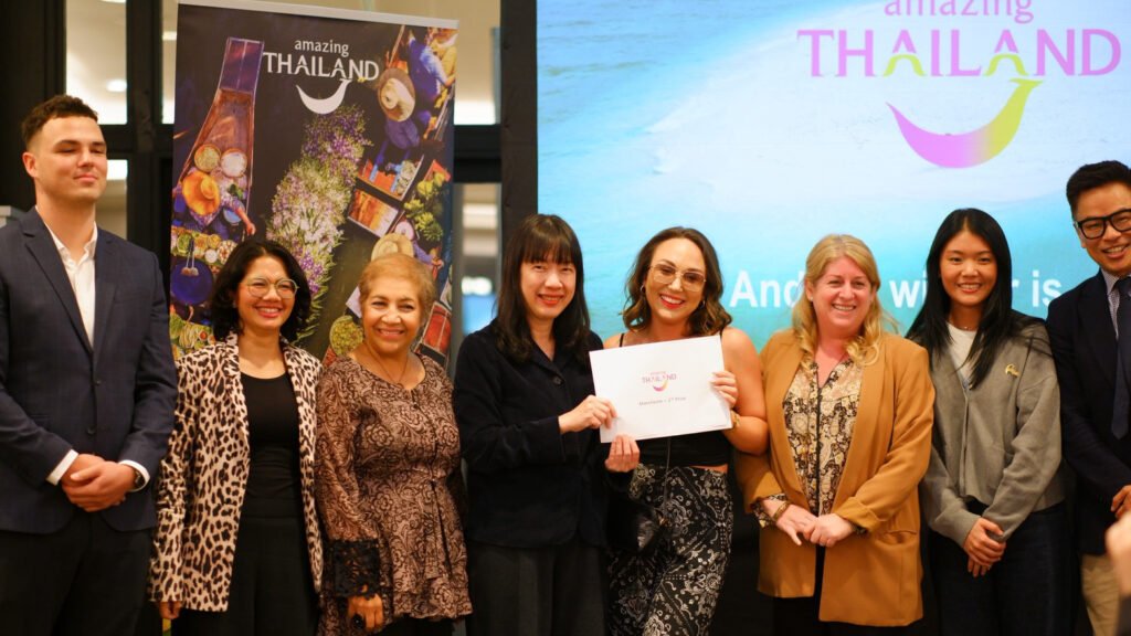 Participants pose during a prize presentation at the Amazing Thailand Roadshow to Manchester.